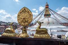 Kathmandu, Nepal, 2023 - The Deer and Dharma Wheel, Buddhist symbols, and Boudhanath stupa, from around the 14th Century CE.