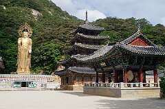 Songnisan, Korea, 2014 - The gold-plated Maitreya Buddha statue, five-storey wooden pagoda and the bell pavilion at Beopju-sa temple, dating back to 553 CE.