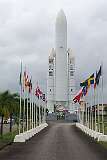An Ariane rocket and flags of the participating countries in the European Space Agency, at the entrance to the Centre Spatial Guyanais, Kourou.