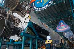 The first stage of Saturn V with the emblems of the different Apollo missions to and around the moon, at Kennedy Space Center Visitor Complex.