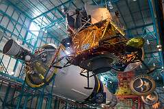 The third stage of the three-stage Saturn V, with a moon lander and the emblems of the Apollo missions.