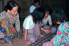 Punanba, Sarawak, Malaysia, 1979 - Playing a Mancala game, universal from East Africa to East Asia.