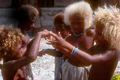 Sulufou, Malaita, Solomon Islands, 1982 - Girls playing a string game.
