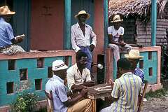 Jacmel, Sud-Est, Haiti, 1980 - Men playing dominoes.