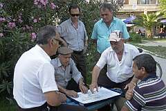 Vlora, Albania, 2007 - Playing cards in a small park.