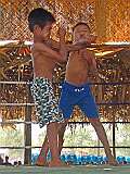 Taungale, Kayin State, Myanmar, 2006 - Boys' traditional boxing match at festivities for Karen New Year.
