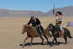 Sagsai, Bayan Ölgii, Mongolia, 2011 - “Qyz quar” (kiss the girl), a Kazakh horse game: a boy tries to kiss a girl at full gallop, while she tries to beat him with a whip.