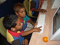 Gordonvale, Queensland, Australia, 2005 - Playing games during lunch in the Mac computer room at Djarragun College.