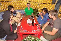 Xilamuren, Inner Mongolia, China, 2011 - A Mongolian guide and tourists play the “Uno” card game, at a Ger camp north of Hohhot.
