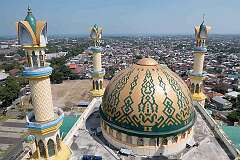 Mataram, Lombok, Indonesia - View from the minaret of the Masjid Raya Hubbul Wathan Islamic Centre, looking west towards Ampenan.
