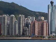 Hong Kong, China - The skyline of Hong Kong and Victoria Peak behind it from the ferry to Lantau island.