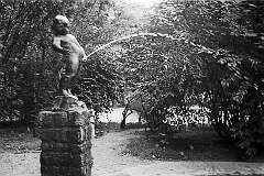 Zagreb, Croatia - The fountain statue “Dječak koji piški” (Boy having a pee) by Antun Augustinčić in Park Kralja Petra Svačića.